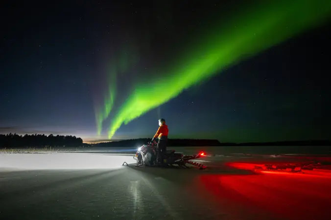 Northern lights snowmobile experience with dinner Night snowmobile safari in Lapland