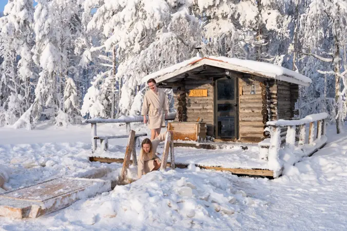 Private Wilderness Sauna & Swimming Experience in Lapland Private sauna by a winter lake