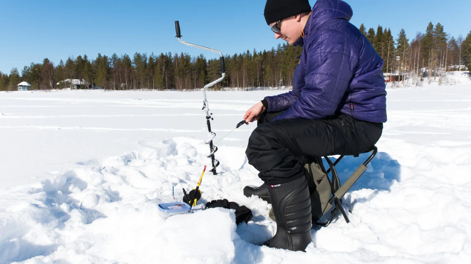 Guided ice fishing on a frozen lake