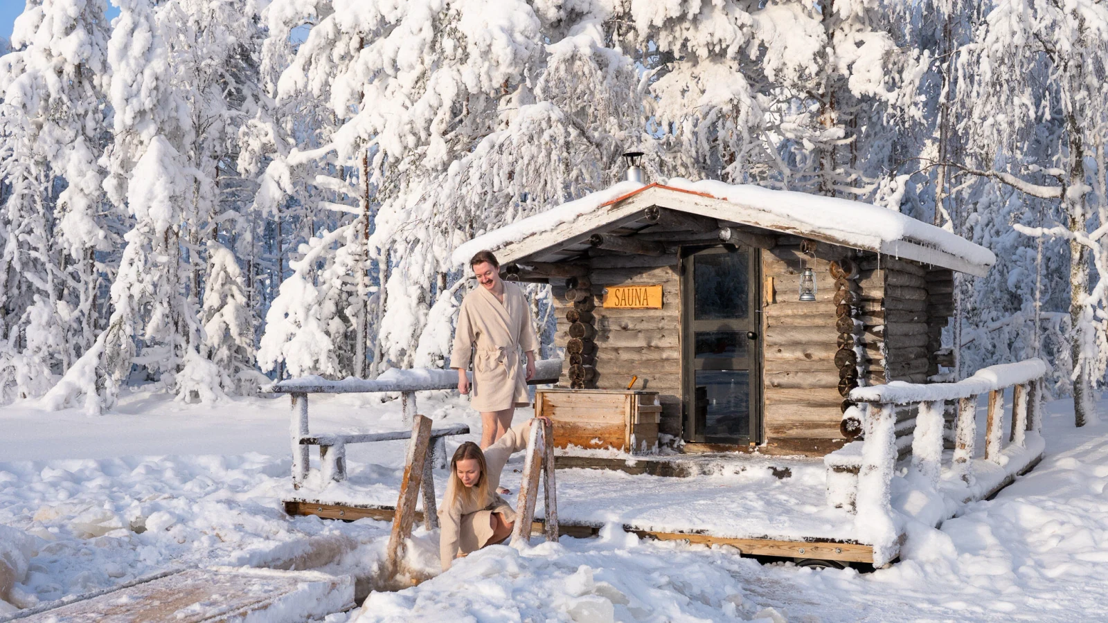 Private sauna by a winter lake